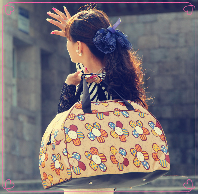 2014新款时尚太阳花旅行包女手提旅游包包斜挎行李包大容量旅行袋